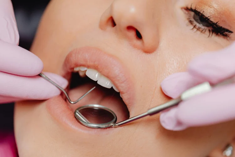 Woman receiving emergency dental repairs close-up