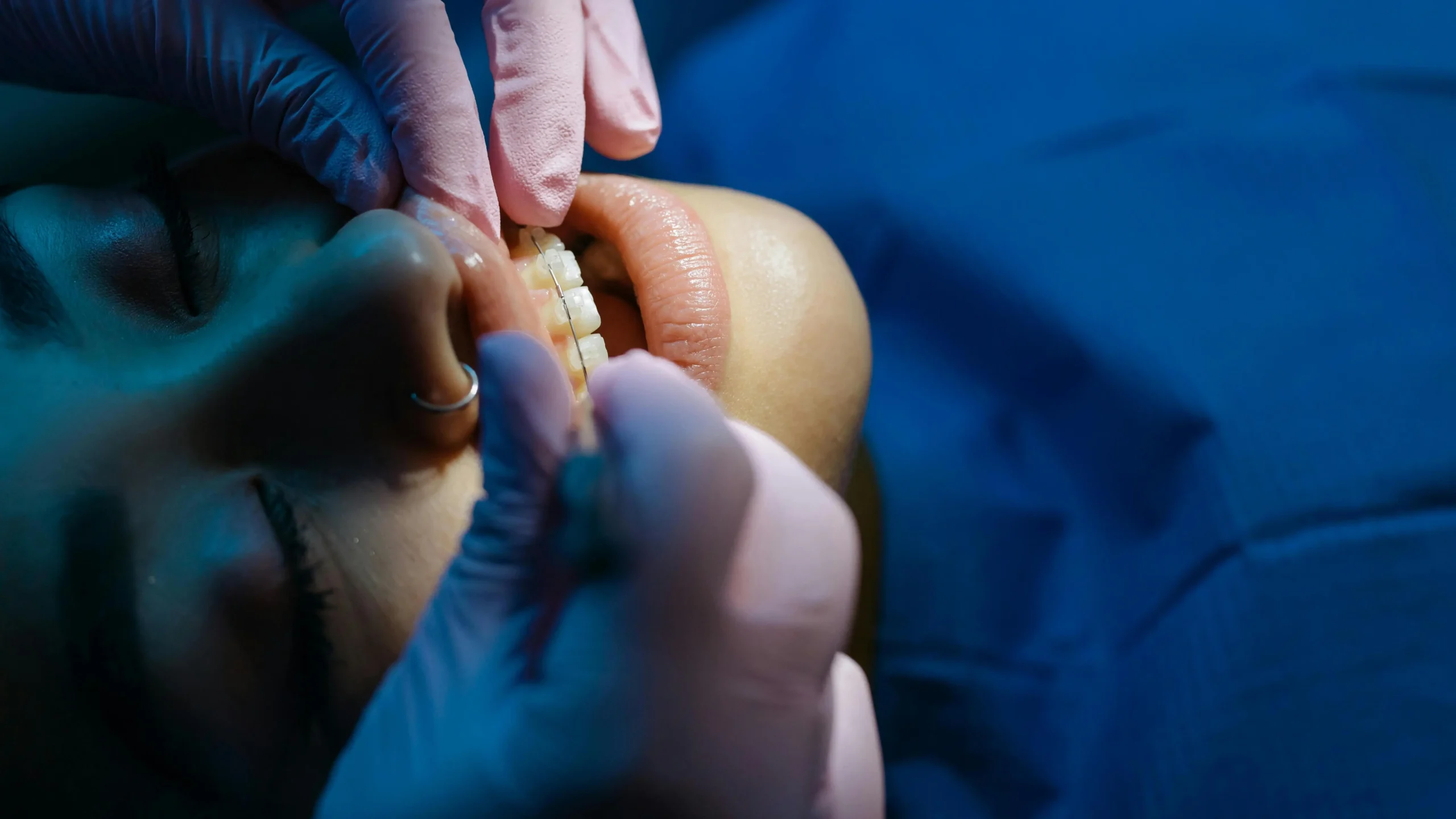 Dentist examining patient's teeth for dental crown procedure