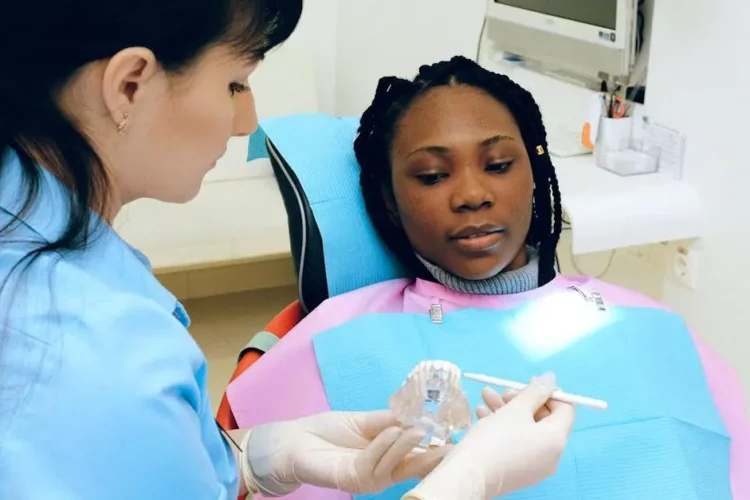 Experienced dental professionals performing a dental check-up on a patient