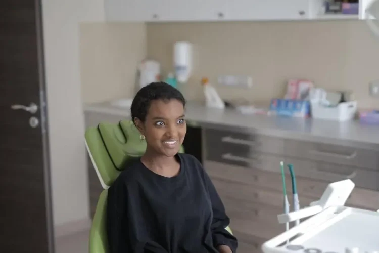 Young woman in dental chair at modern clinic for sleep dentistry near me