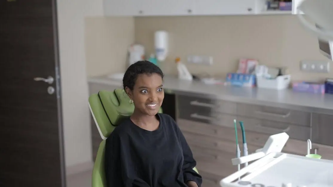 Young woman in dental chair at modern clinic for sleep dentistry near me