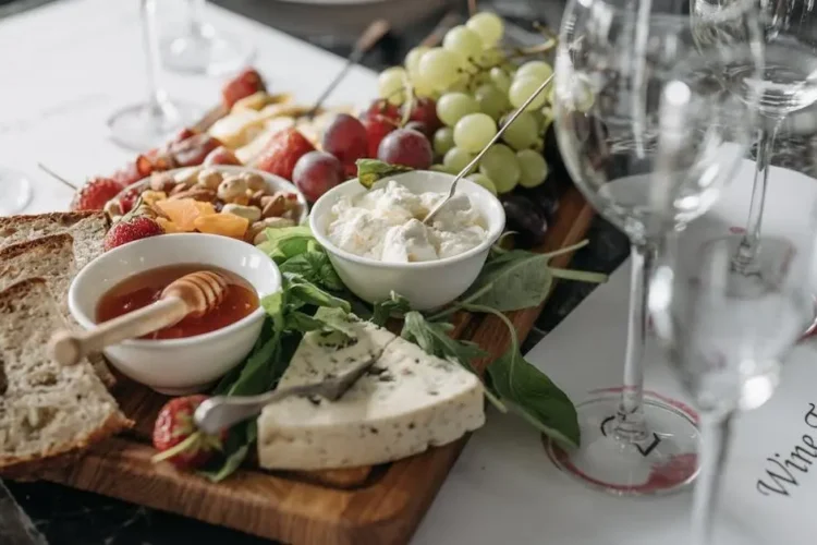 Charcuterie board featuring cheese varieties good for teeth.