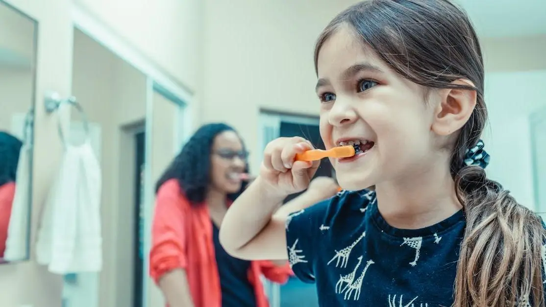 Child brushing teeth for children's oral hygiene.