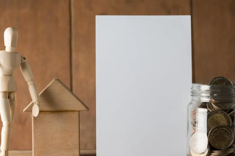 Money saving jar, blank paper, and wooden figurine for cost planning for braces