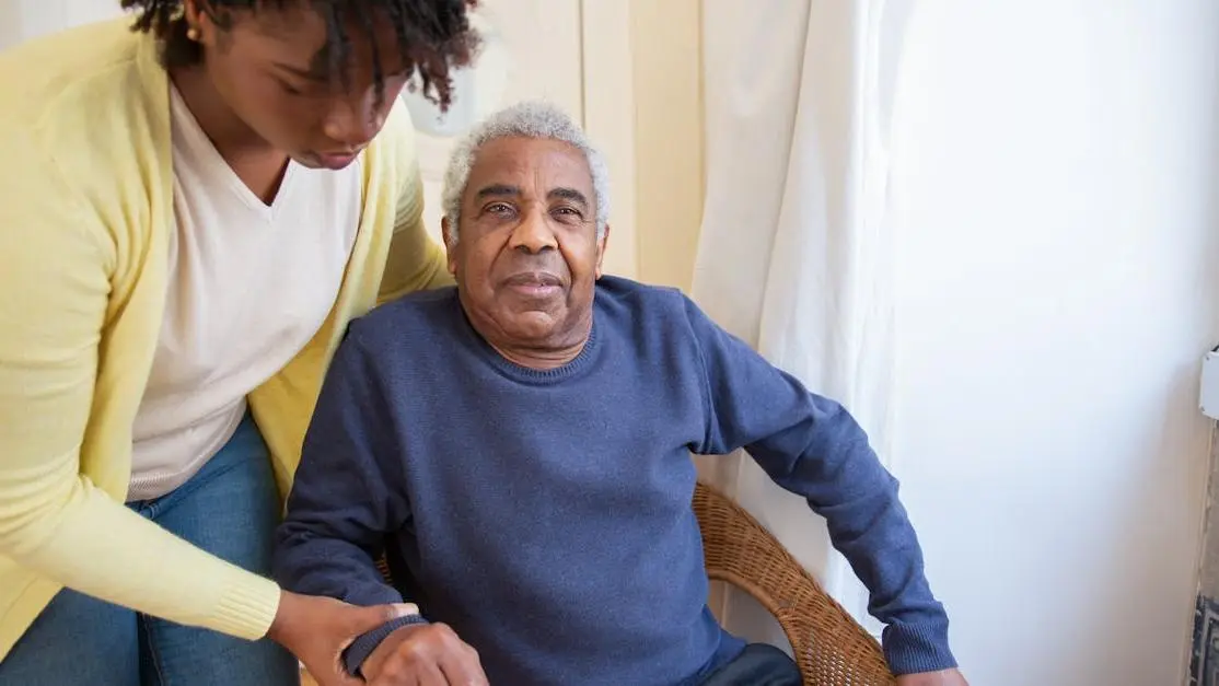 Elderly man receiving care in a dental home setting.