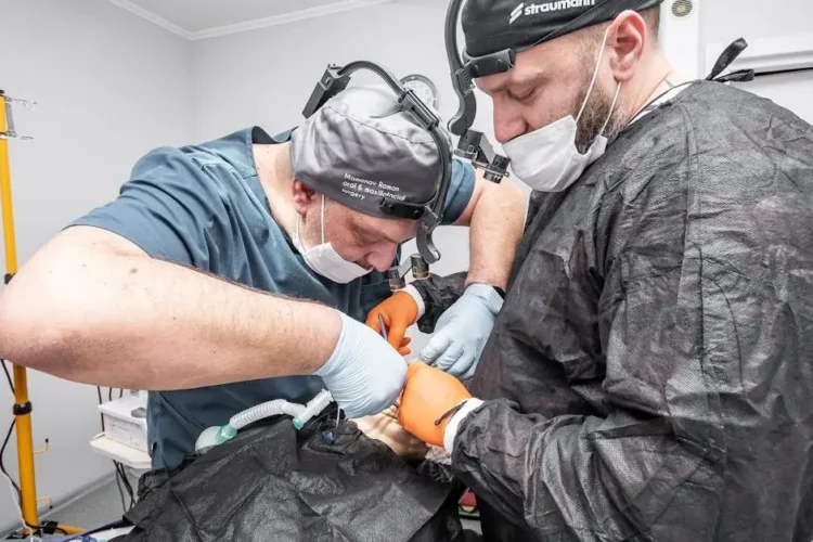 Dental specialists near me assisting a patient in a clinic.