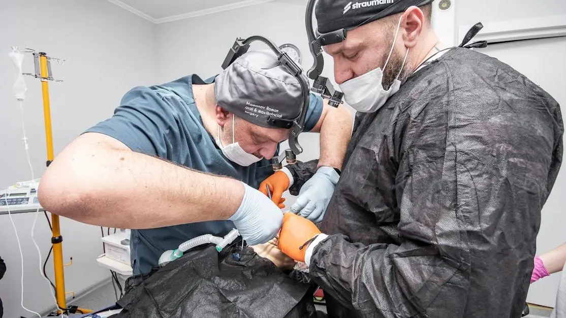 Dental specialists near me assisting a patient in a clinic.