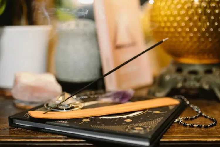 Aromatherapy products for extraction aftercare on a wooden table.