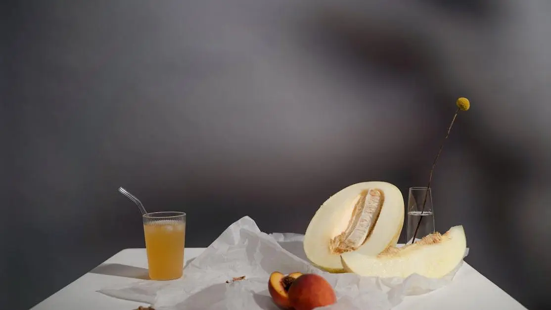 Fruit bowl with orange juice highlighting fruit versus juice debate.