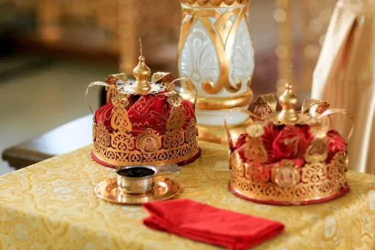 Dental crowns arranged on a table, related to getting a crown or bridge.