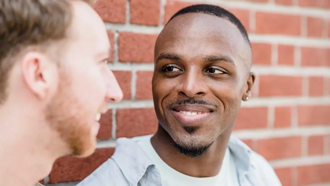 Smiling men showcasing results of Invisalign for crowded teeth