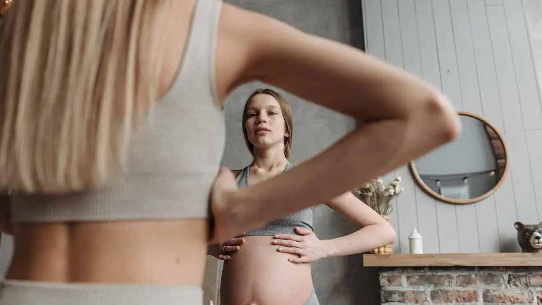 Pregnant woman practicing oral health care during pregnancy.