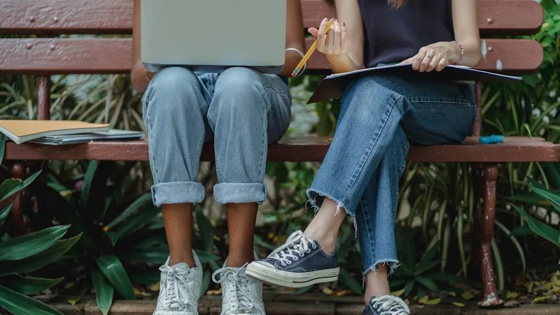 Students engaging in oral health education on a laptop outdoors