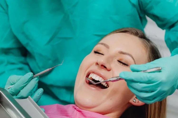 Woman smiling during pain-free dental checkup near me