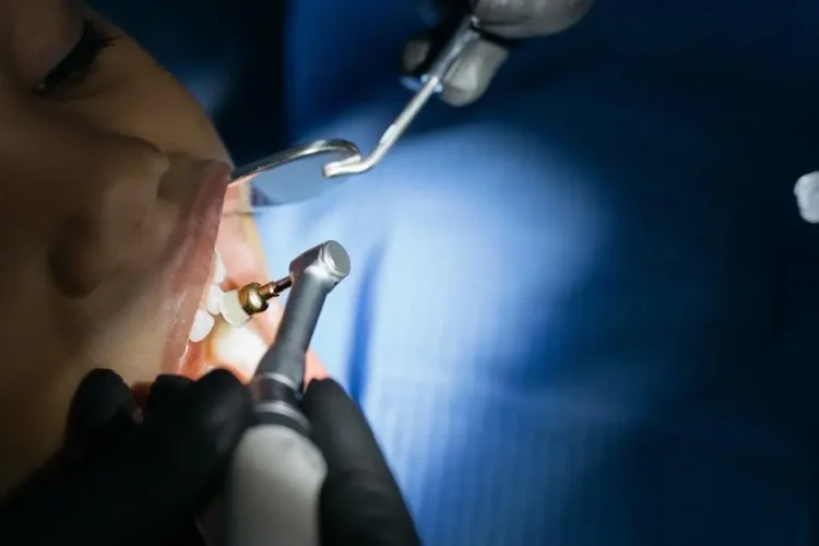 Child receiving dental checkup from a pedodontist