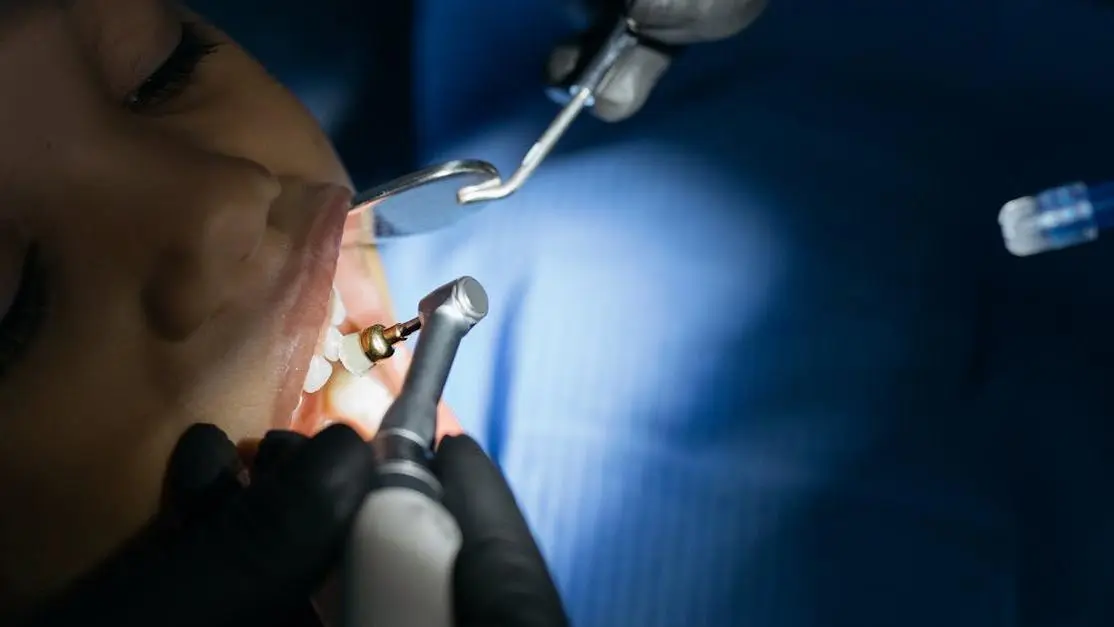 Child receiving dental checkup from a pedodontist