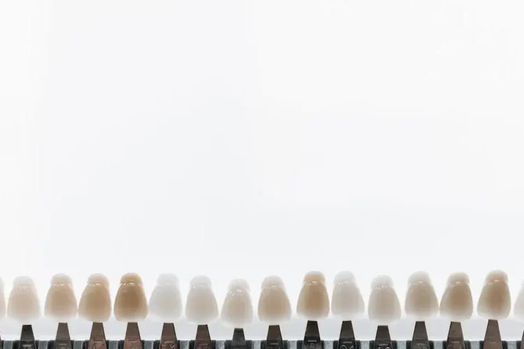 Porcelain veneers enhancing smile against bright background