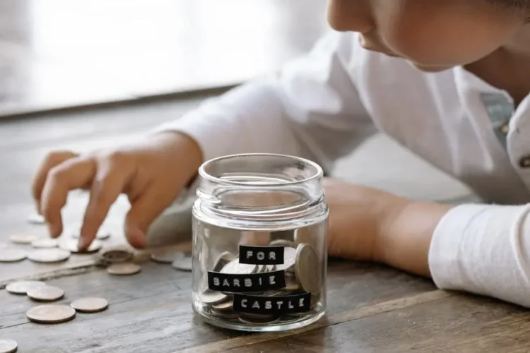 Child explores saving strategies using coins, highlighting ways to save money on dental care.