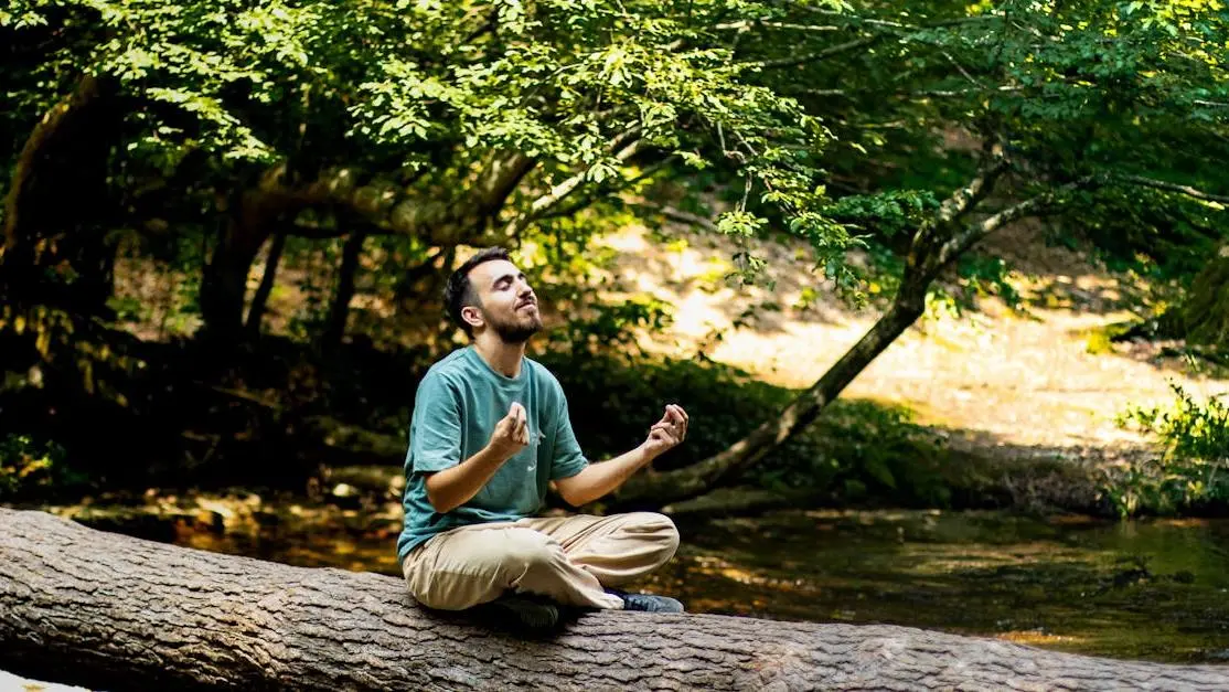 Meditating man in forest, related to sedation dentistry for phobia.