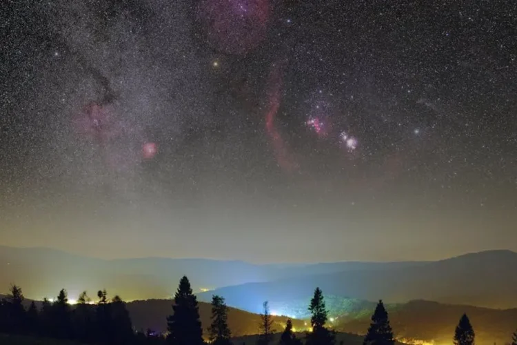 Clear night sky over a valley illustrating sleep dentistry for snoring.