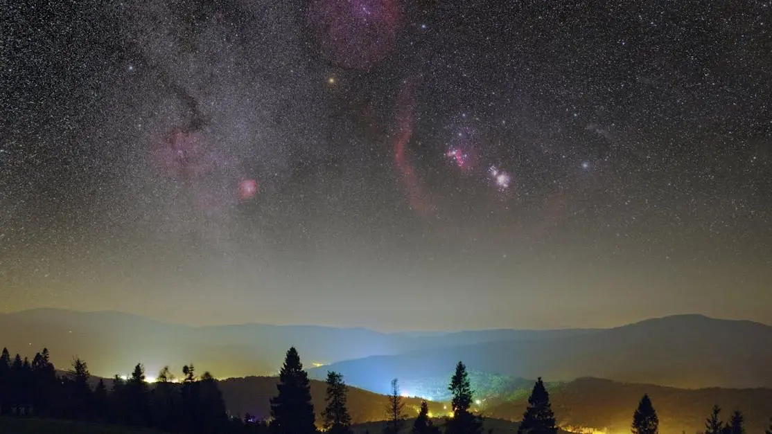 Clear night sky over a valley illustrating sleep dentistry for snoring.