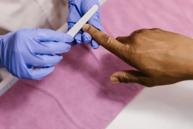 Dentist in latex gloves performing cosmetic dental procedure