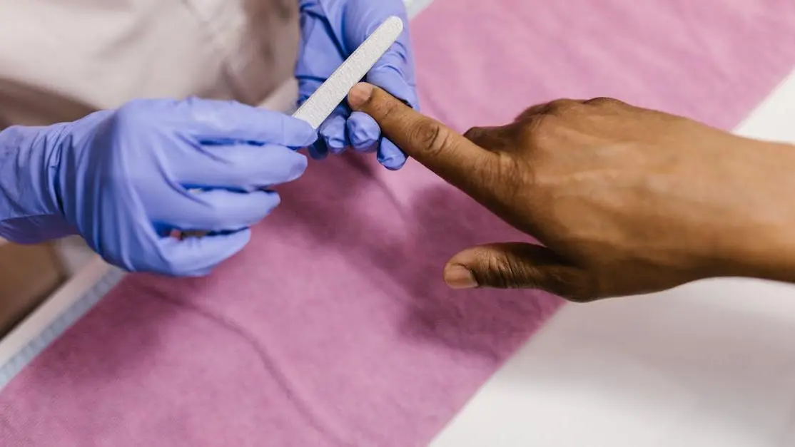 Dentist in latex gloves performing cosmetic dental procedure