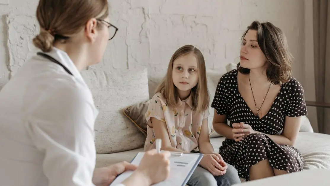 Dentist consulting with a mother and daughter for specialist dental care near me