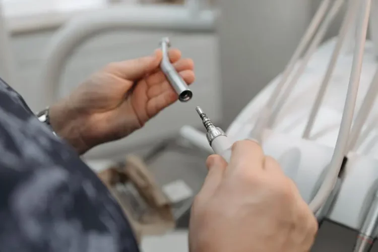 Dentist using a tool for specialty dentistry procedures