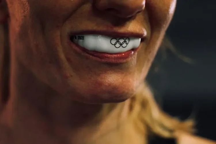 Woman wearing sports mouth guard for protection during athletics