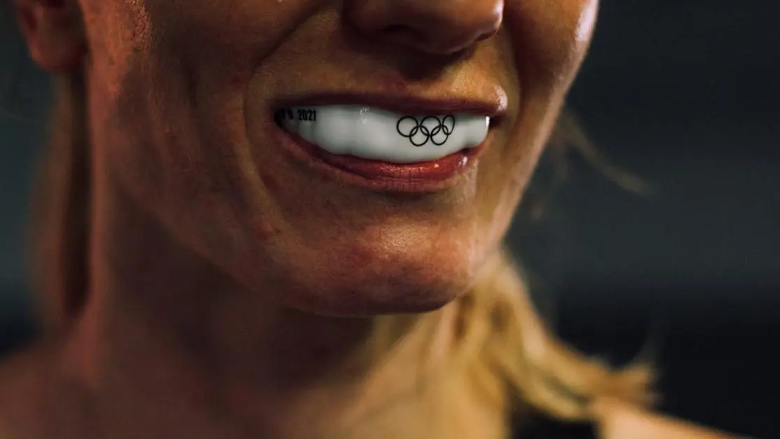 Woman wearing sports mouth guard for protection during athletics