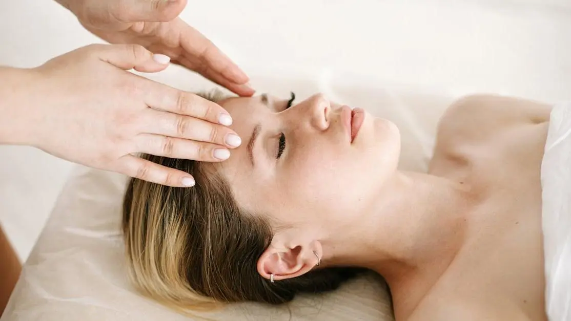 Woman receiving a massage to stop grinding teeth.