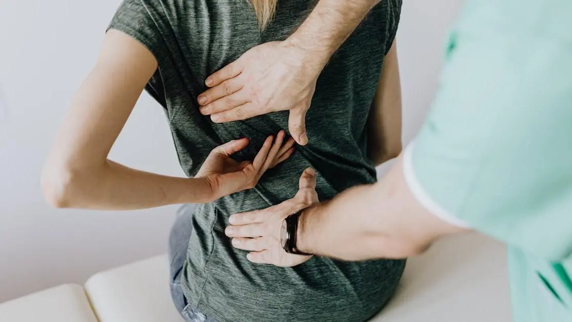 Dentist examines woman's teeth for grinding signs