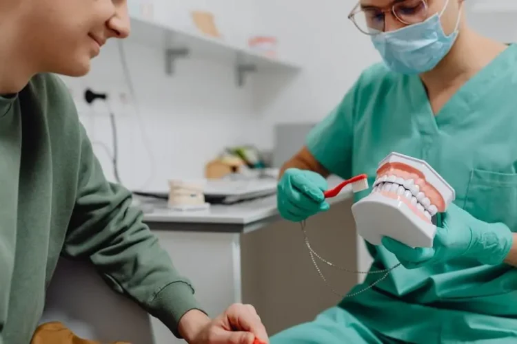 Dentist giving patient tips on choosing your dentist