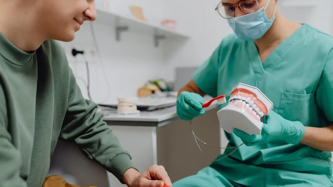 Dentist giving patient tips on choosing your dentist