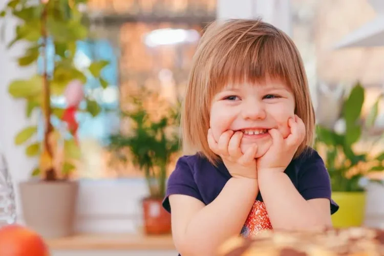 Toddler smiling, showcasing tmj wellness.