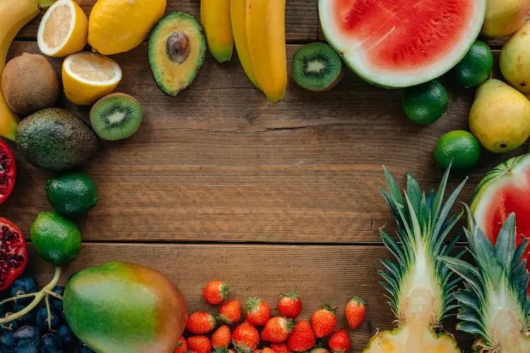 Tooth smart snacking with assorted sliced fruits on a wooden table