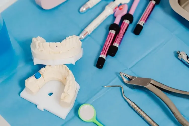 Dental cast and instruments showcasing types of dental implants materials