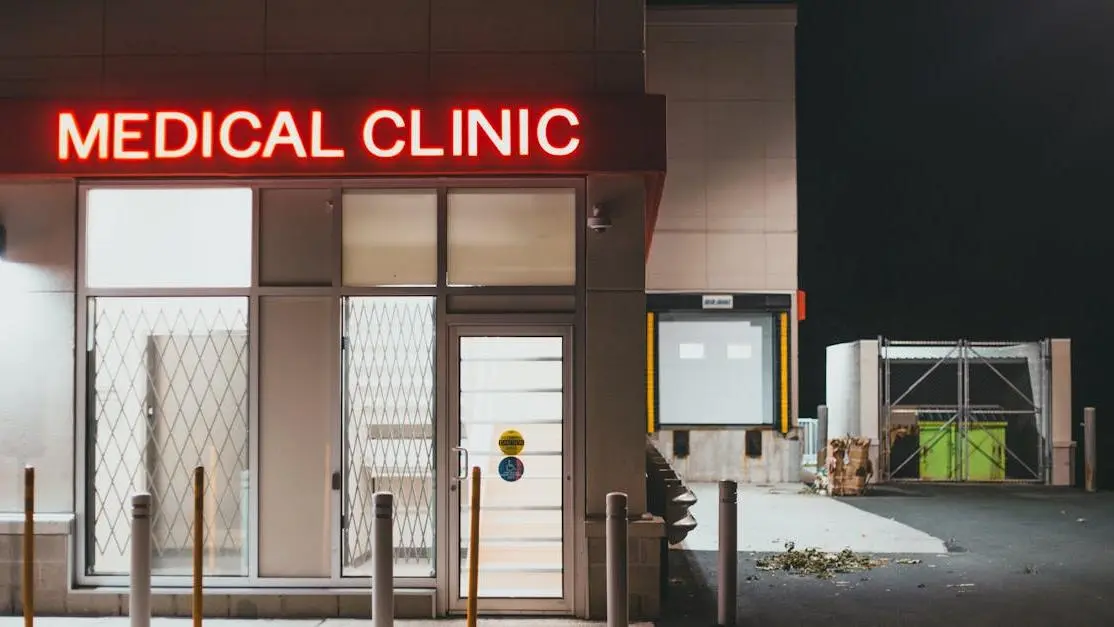 Neon-lit entrance of a dental clinic at night, emphasizing 24/7 dental emergency services.