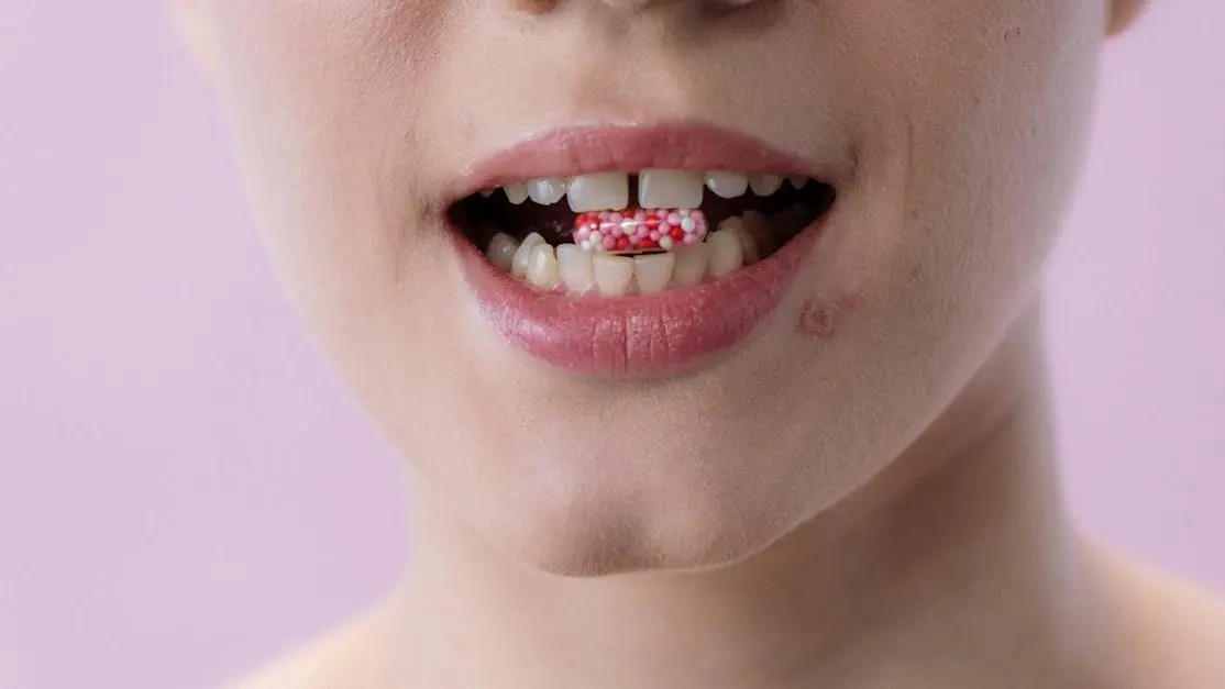 Smiling woman illustrating the benefits of flossing.