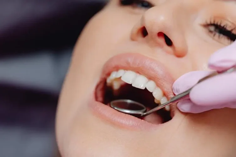 Dental checkup with tools, highlighting chewing gum's impact on dental health.