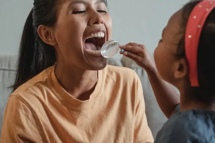 Mother and daughter exploring dental health, relating to common dental questions.