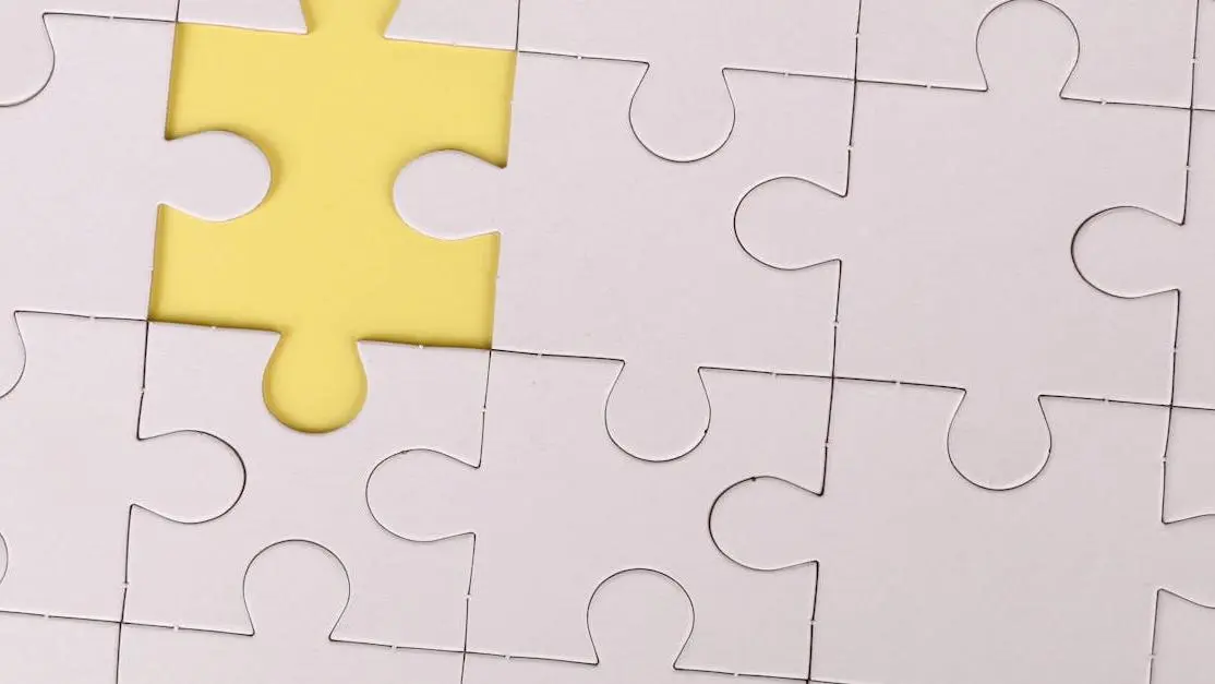 Missing yellow piece in white jigsaw puzzle symbolizing common oral health problems.