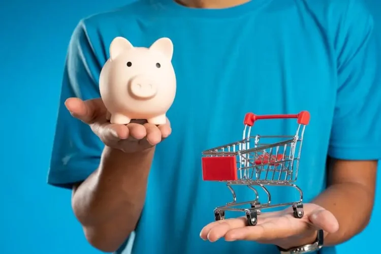 Savings vs. spending concept for the cost of cosmetic dental procedures, with piggy bank and mini shopping cart.