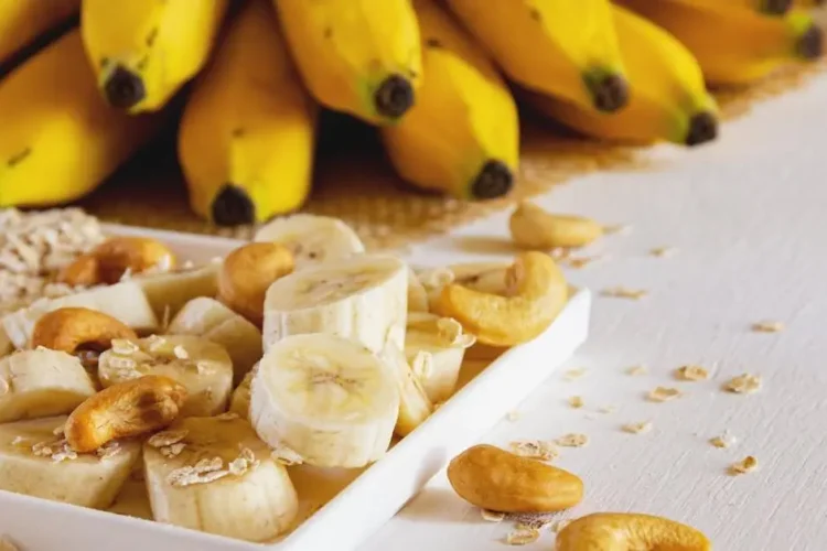 Nutritious breakfast with bananas, cashews, and oats highlights the effects of diet on oral health.