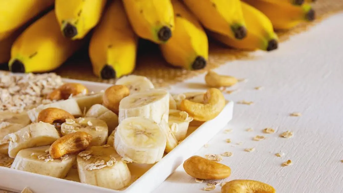 Nutritious breakfast with bananas, cashews, and oats highlights the effects of diet on oral health.