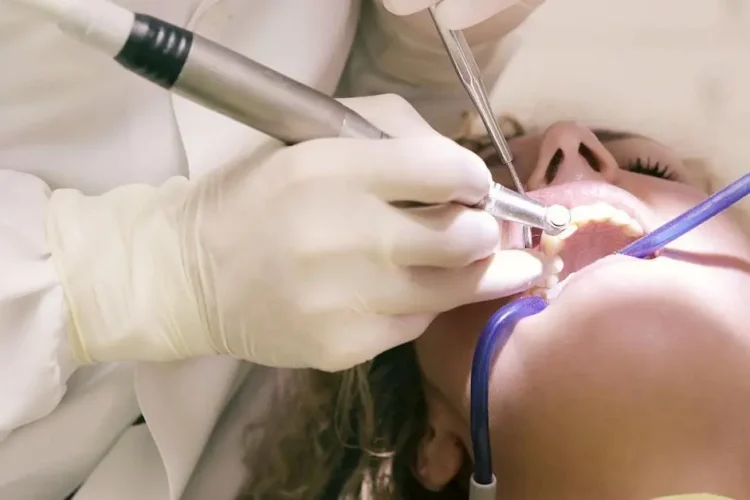 Dentist performing endodontics on a patient's teeth