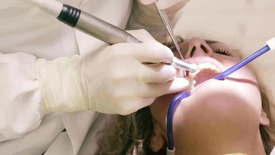 Dentist performing endodontics on a patient's teeth