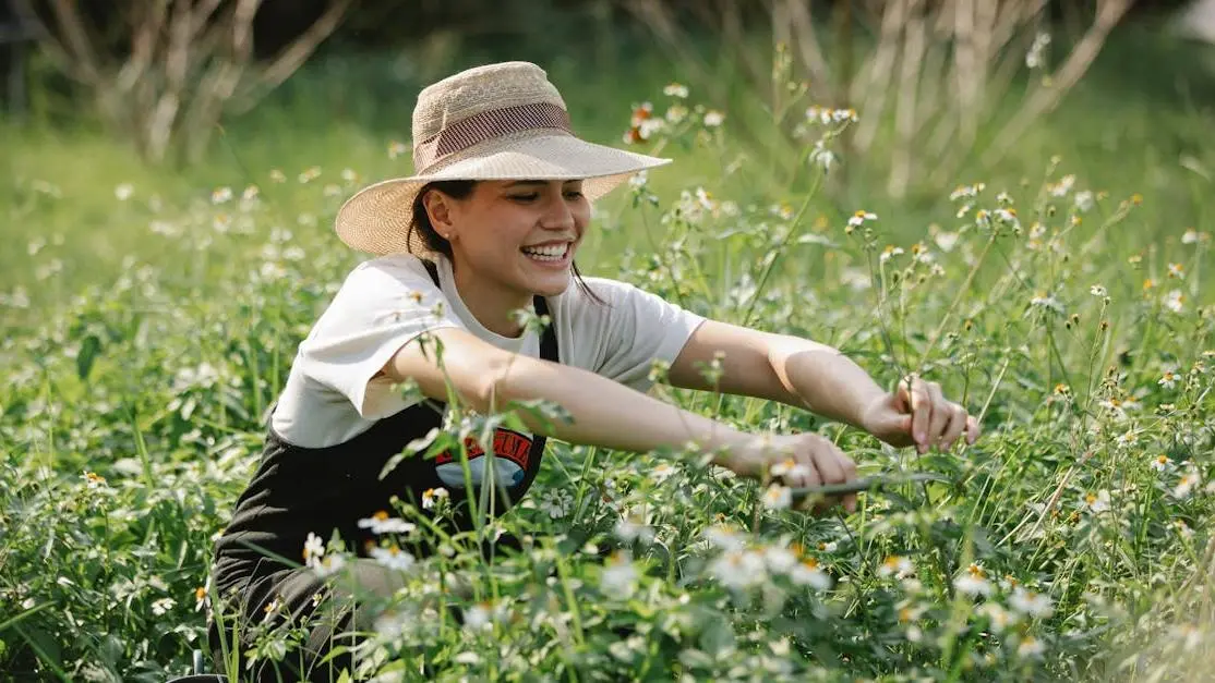 Cheerful woman gardening, illustrating how to maintain good oral health through healthy lifestyle habits.