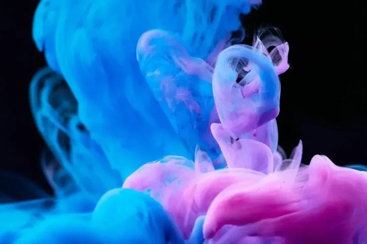 Colorful mouthwash diffusion in water captured in high-speed photography